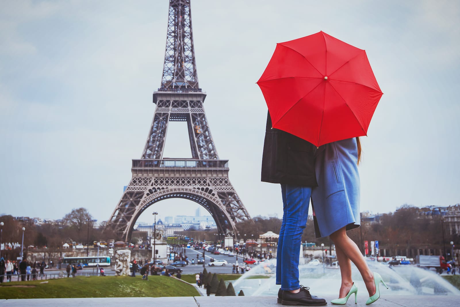 Couple kissing with Eiffel Tower in the background