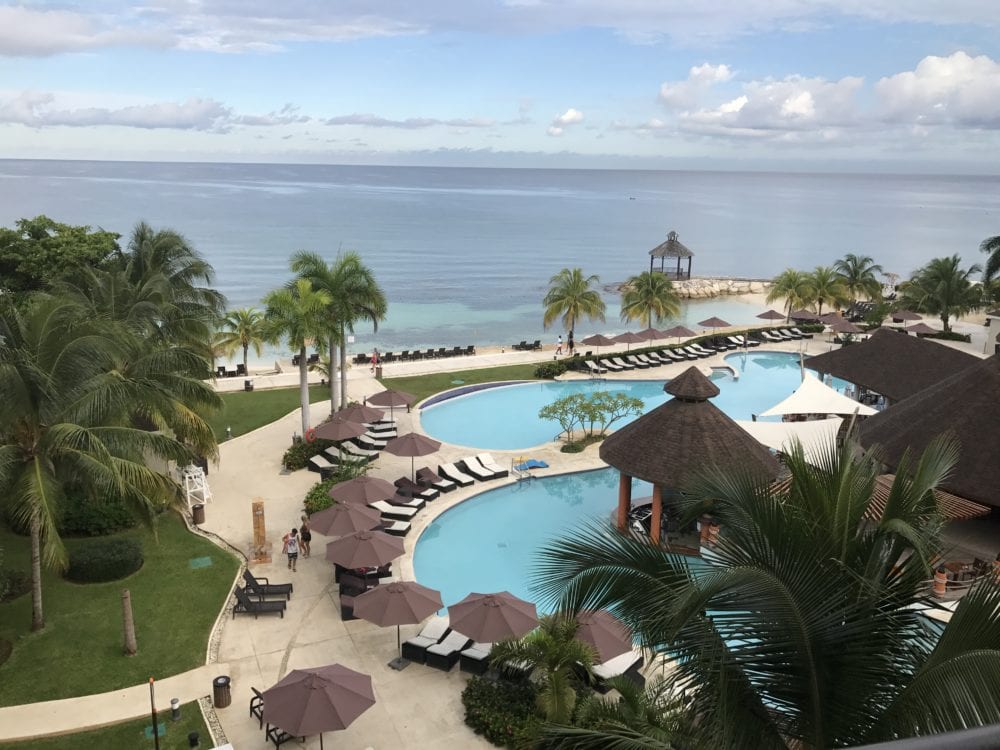 Pool and ocean view at Secrets Wild Orchid