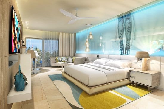 The best luxury resorts in Jamaica for couples - An inside look into a room with a King sized bed at the Breathless Montego Bay Resort.