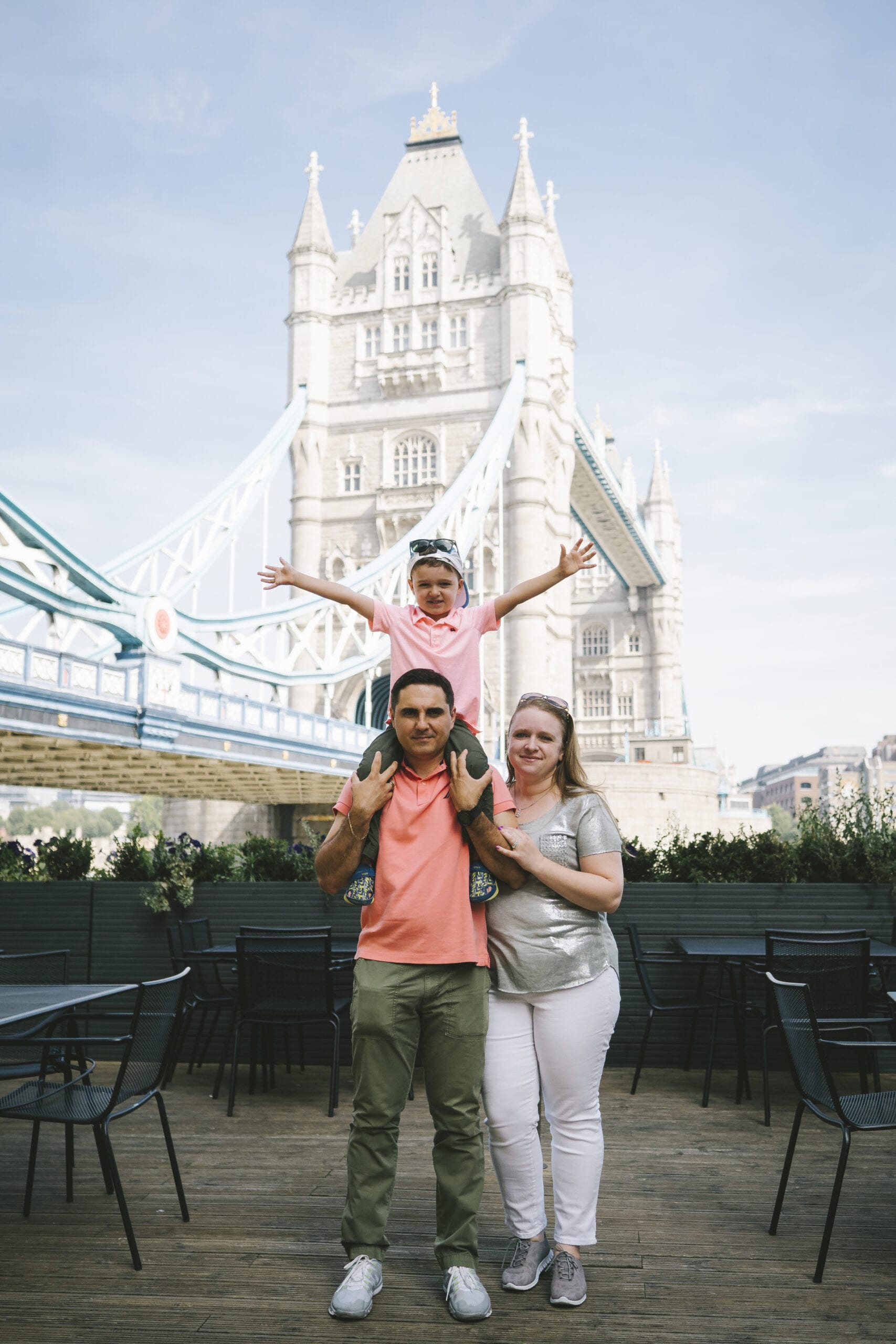 Family in front of Tower Bridge in London, England