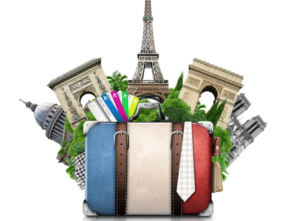 Image of a suitcase with France flag and France landmarks in the background